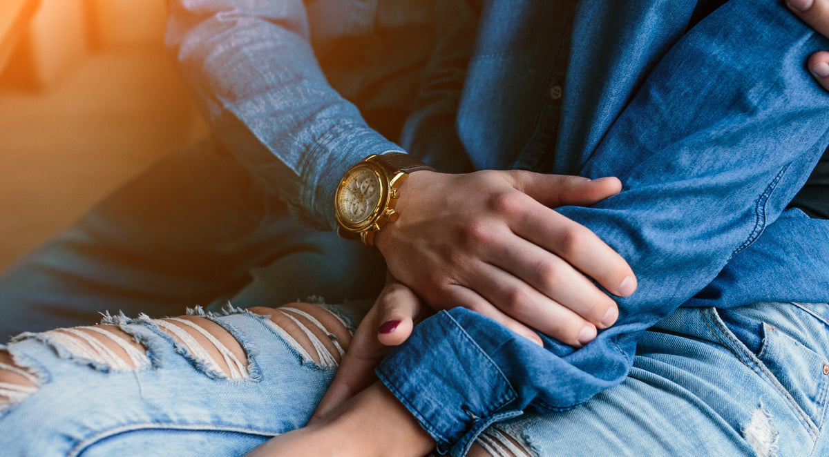 couple in demin clothes with man wearing a watch