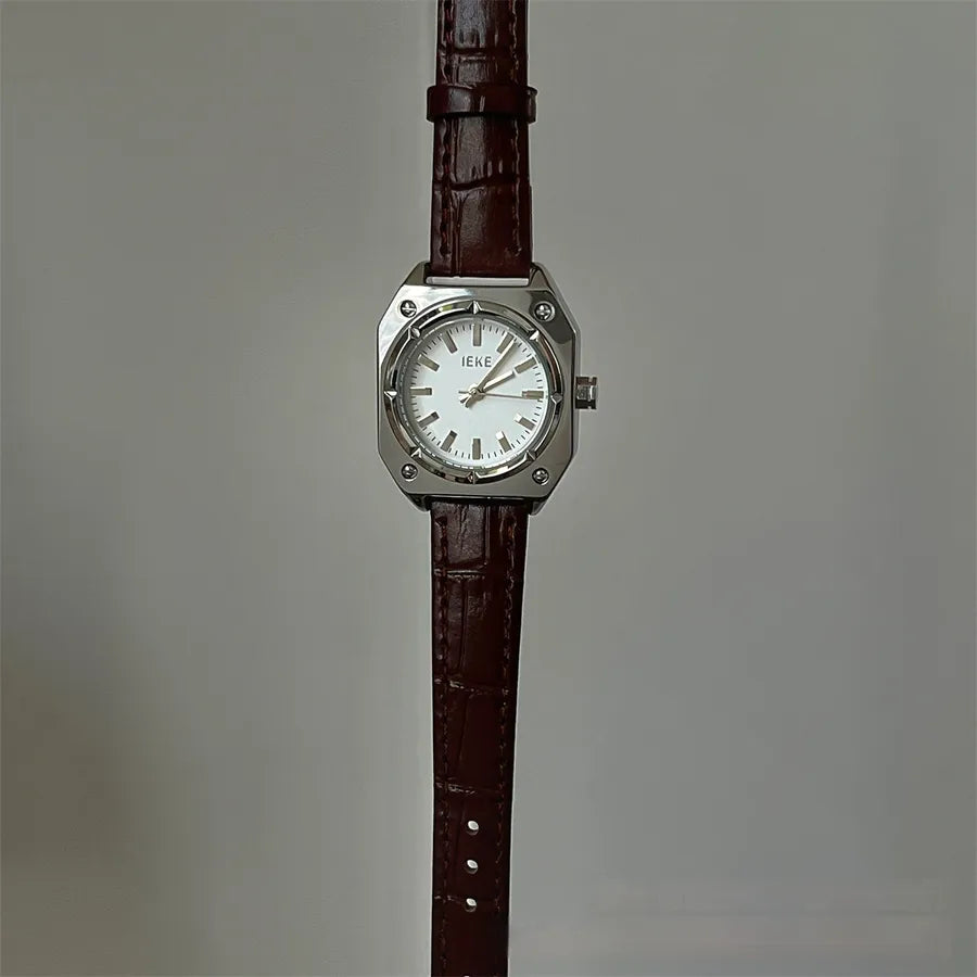 women's wrist watch with dark brown leather strap with silver and white face